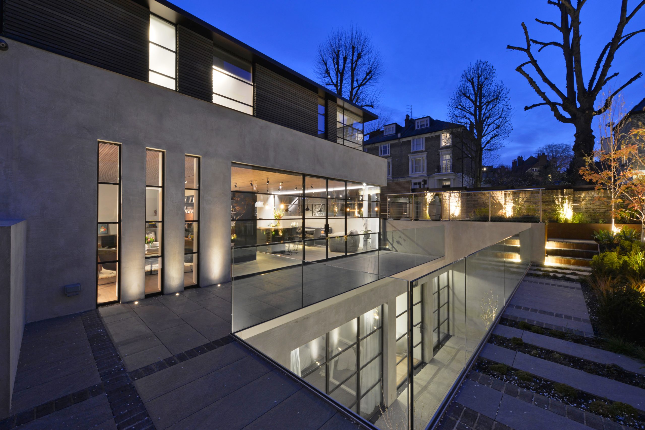 windows passive house new construction - steel look windows luxury home night exterior